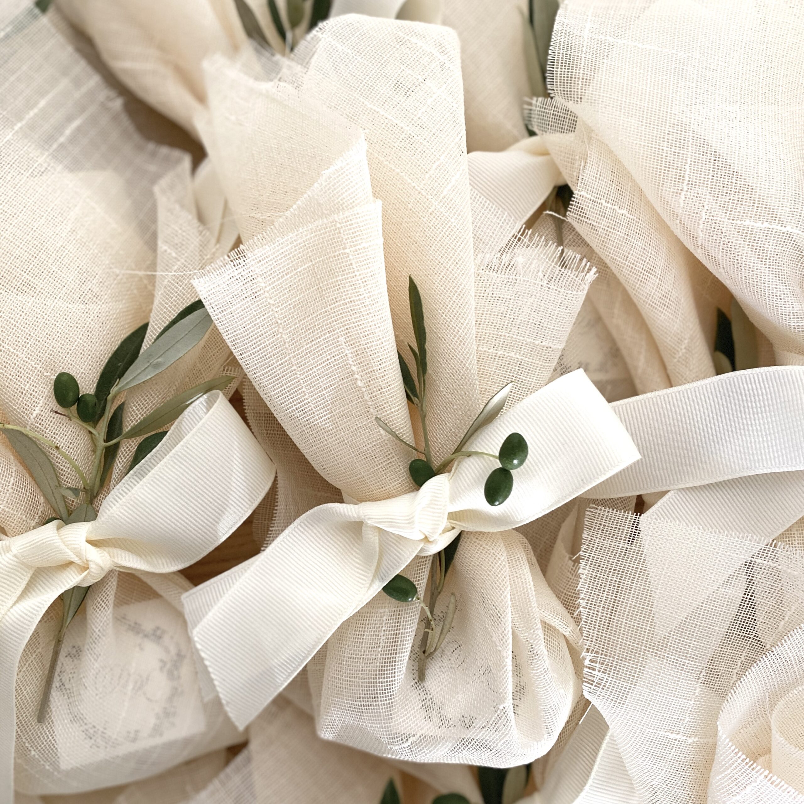 a-step-back-in-time-wedding-favors-traditional-olive-leaves-linen-main-photo
