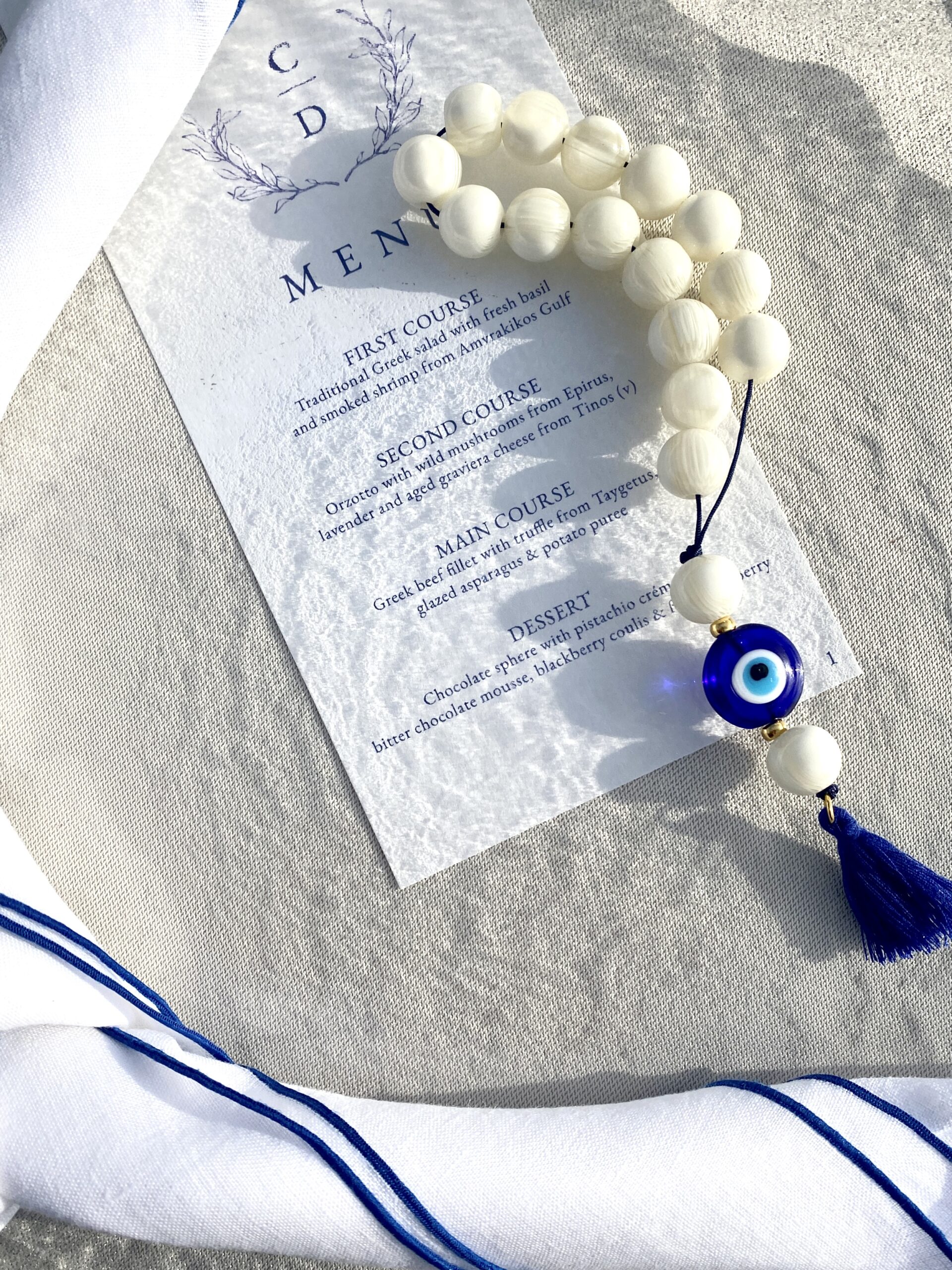 all-about-color-wedding-linen-table-setup-greek-rosary-with-evil-eye