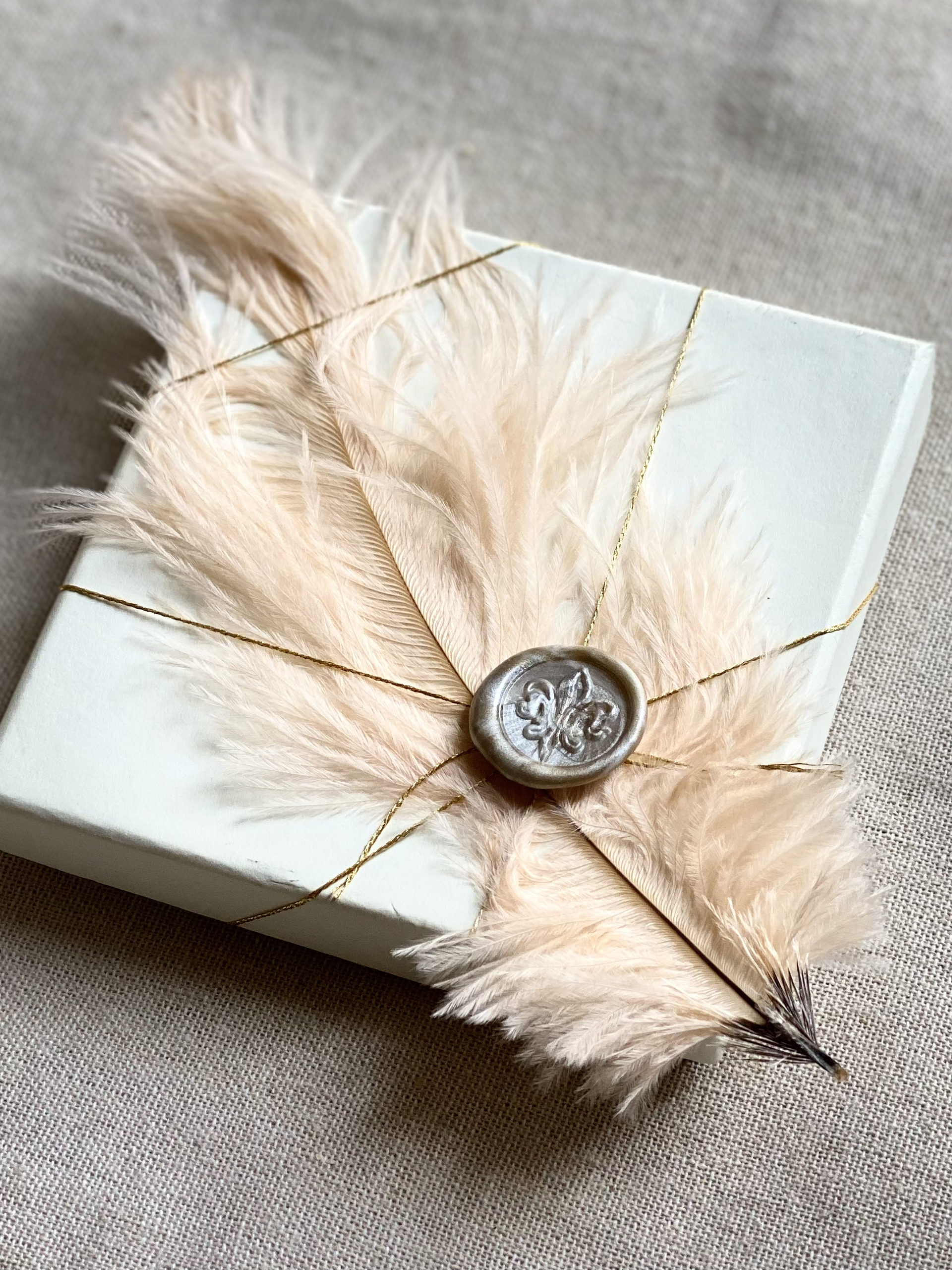 salmon-feather-wedding-favor-box-with-wax-seal-stamp