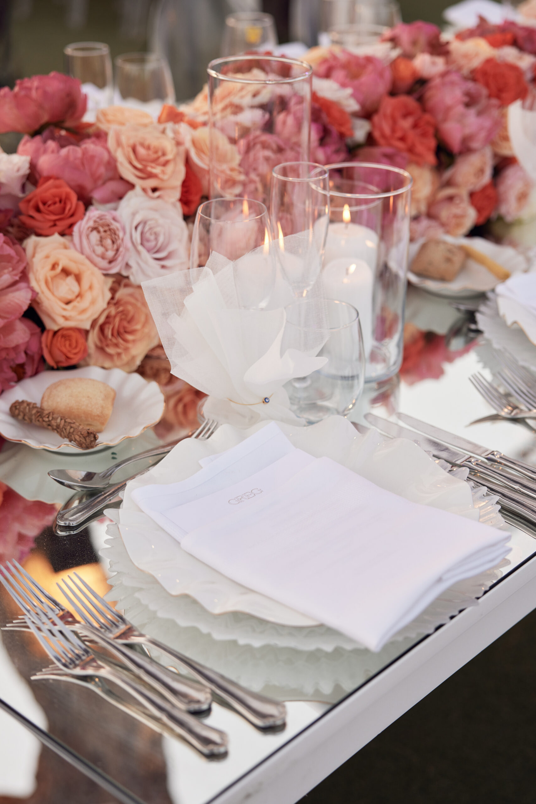 symphony-of-romance-wedding-reception-shades-of-pink-and-peach-linen-favors-with-evil-eye-main-photo