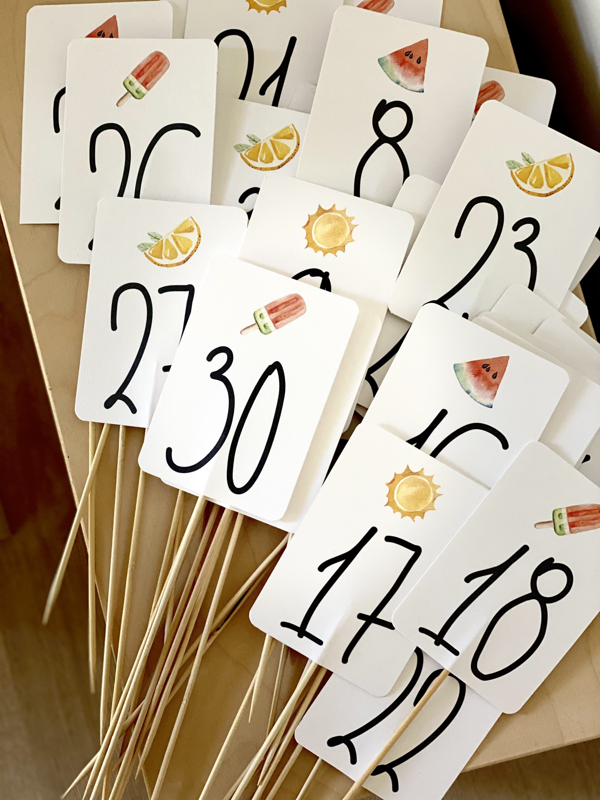 that-summer-feeling-baptism-table-numbers-sticks